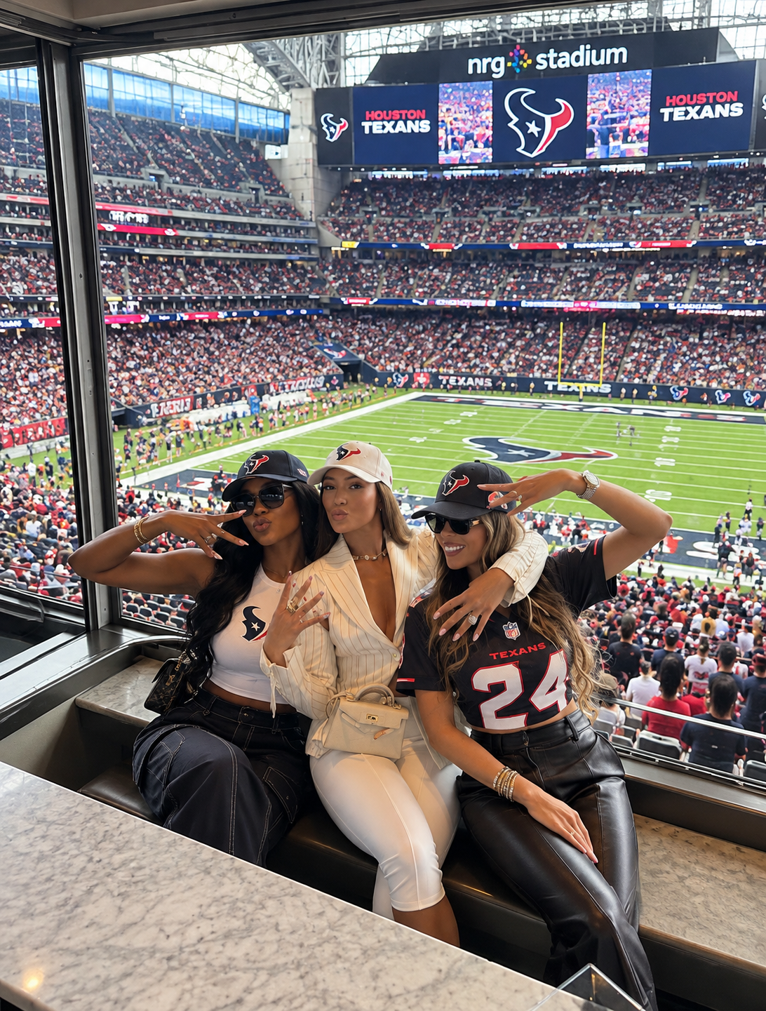 CEO BAE women at NRG Stadium watching the Houston Texans